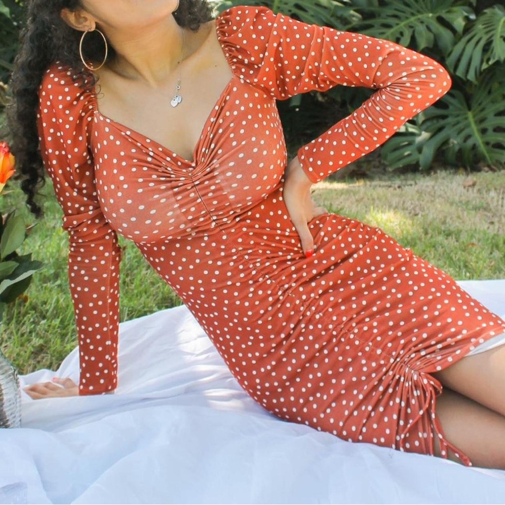 PrettyLittleThing Orange & white polka dot long sleeve dress with ruched middle